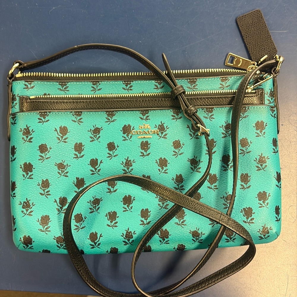Teal Coach Badlands Crossbody with Black Floral Print and Black Pouch